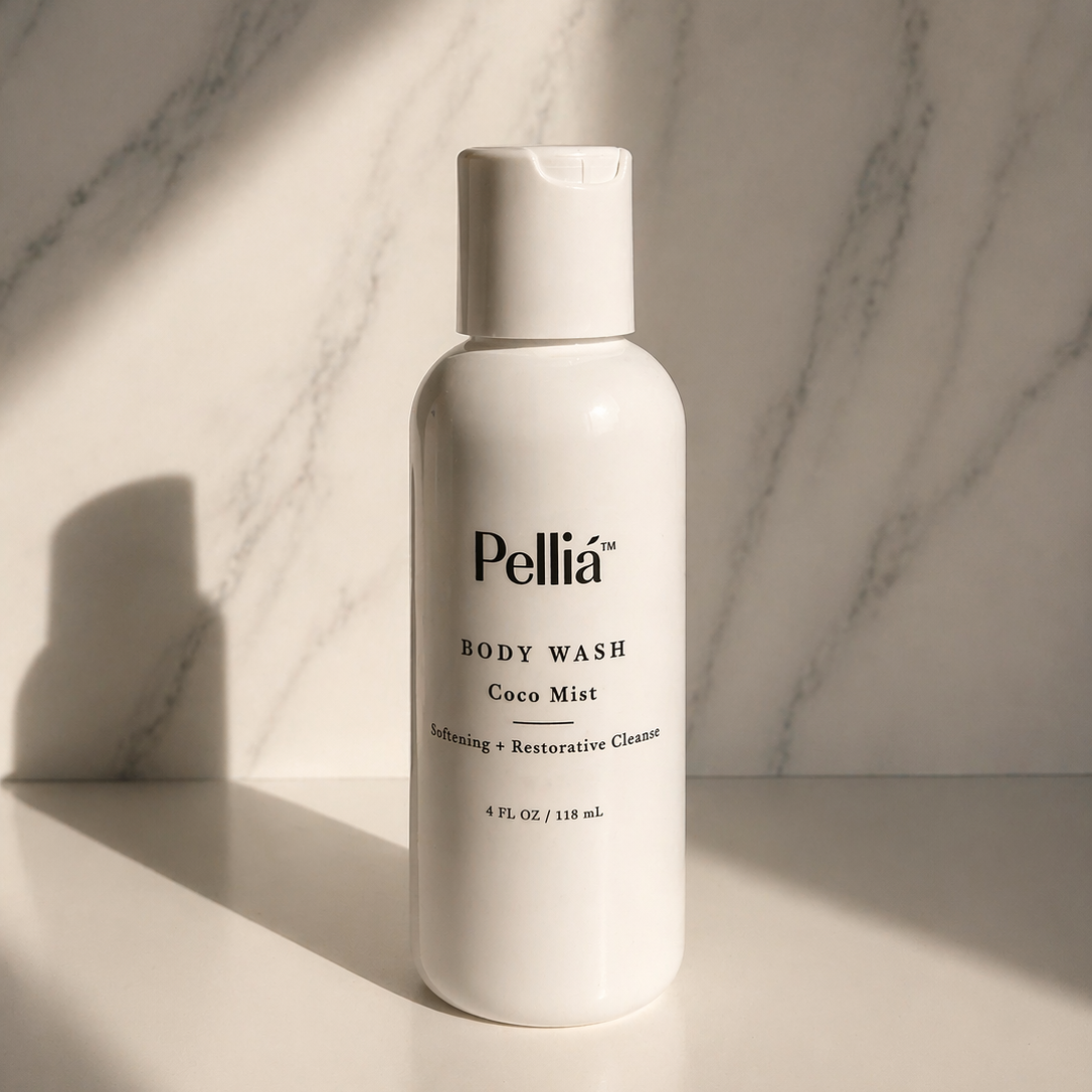Pellia body wash mini travel bottle on a marble surface